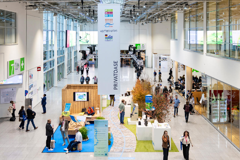 Panoramic view of the aisles at the Aquanale 2025 trade fair at Koelnmesse, Cologne, with Pool & Wellness stands and the “PRIVATOASE” area.