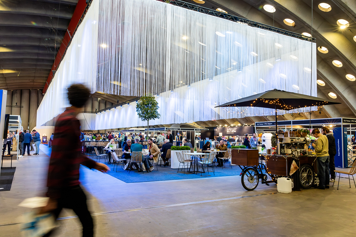 Professionals networking and discussing pool technologies at PoolXpo 2026 trade fair in Brabanthal, Leuven, Belgium