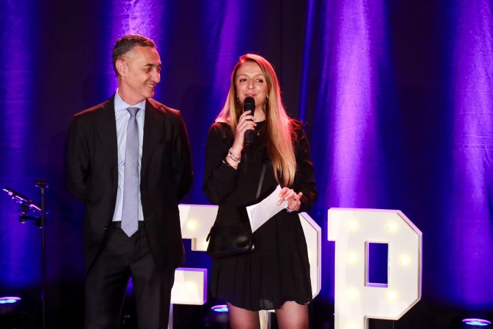 Mr. Figueroa presenting an award with a speaker at the 2026 Trophées de la Piscine et du Spa.