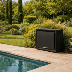 Poolex Airline 360 premium pool heat pump installed next to a luxury swimming pool