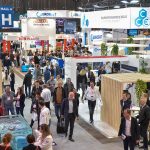 Crowded exhibition aisles at Piscine Global trade show in Eurexpo Lyon with pool equipment manufacturer stands