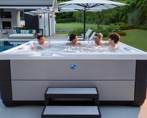 Hot Spring Highlife Grandee hot tub at sunset